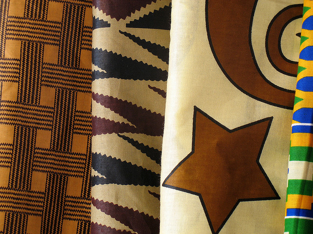 Four patterned African textiles on display