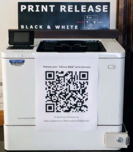 image of printer with QR code and web information