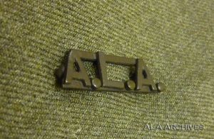 A.L.A. pin on green background.