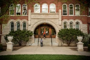 Entrance to the William Albert Noyes Laboratory of Chemistry with students in early spring.