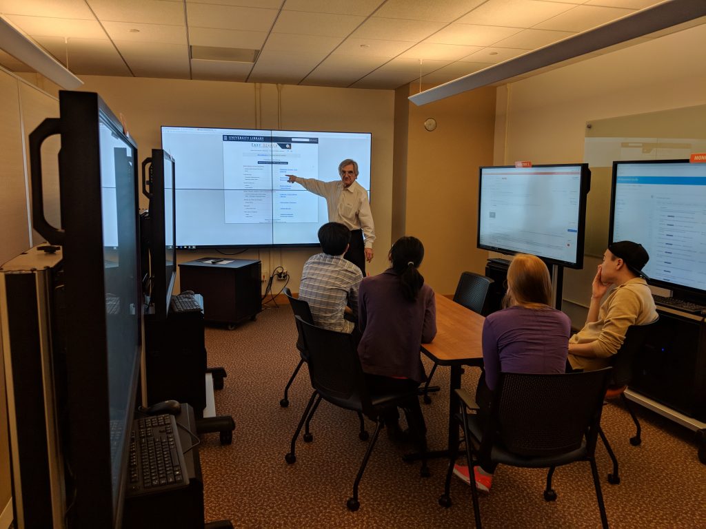 Professor Mischo demonstrating the Informatics Lab to a group of students