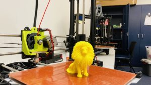 3D-printed lion on 3D printer bed