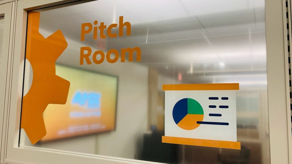 Pitch Room Sign with display monitor displayed in the background