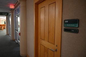 The entrance to the spirituality and reflection space. A sign next to the door says 229: Respite Room