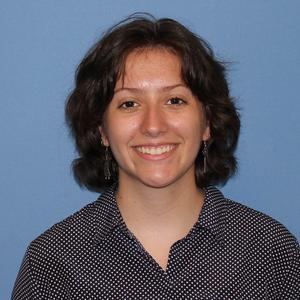 Portrait photo of Abby McBride smiling at the camera