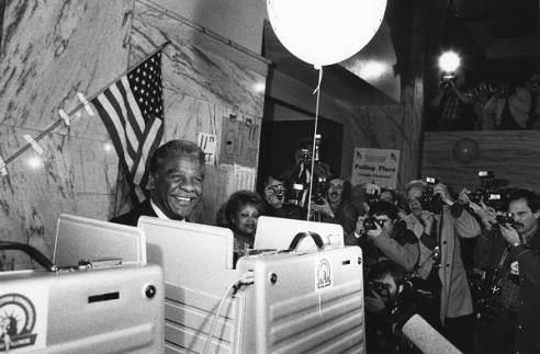 Former Chicago Mayor Harold Washington at a voting booth.