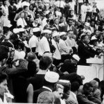 Martin Luther King, Jr. speaks from behind a podium to a crowd during the March on Washington for Jobs and Freedom in Washington, District of Columbia, August 28, 1963.