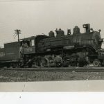 A locomotive along with a coal car