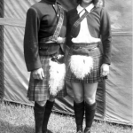 (Left to right) Ernest Clarke and his daughter Ernestine. They wear traditional Scottish costumes, with berets and plaid kilts
