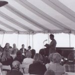 Gwendolyn Brooks reads to the audience at the Ferry Hall Centennial Celebration. At that time she was Poet Laureate for the State of Illinois. In 1985 she became the Library of Congress's Consultant in Poetry, whose title changed the next year to Poet Laureate.