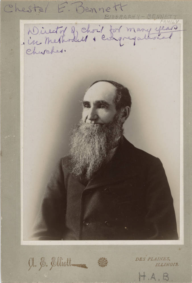 Black and white photograph of Charles E. Bennett, bearded, wearing a dark overcoat.