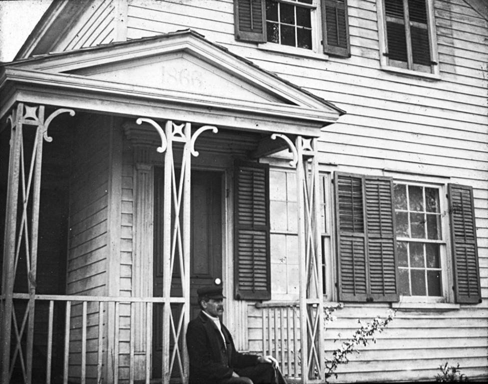 Man_Sitting_on_the_Front_Stoop_of_a_House