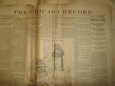 Top half of a front page of the Chicago Record