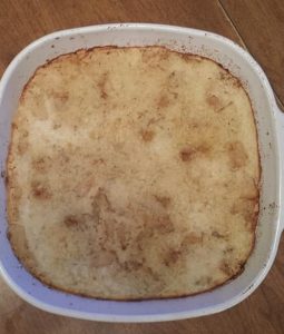 A casserole dish with browned, creamy salsify.