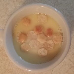 Creamy salsify soup with oyster crackers.