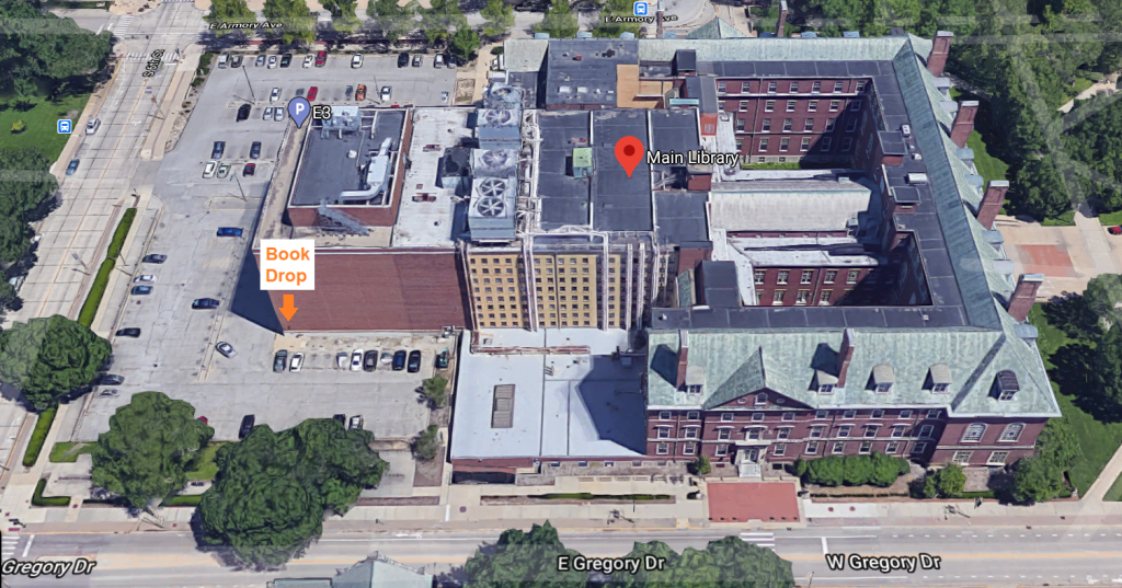 Aerial view of the Main Library and Parking Lot. The bookdrop is located at the Southwest corner of the building, in the parking lot (upper level).