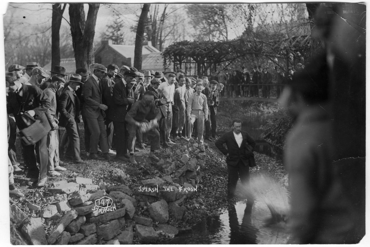 A University of Illinois Freshman is thrown into the Boneyard Creek as part of class rivalry activities, c. 1910-1915