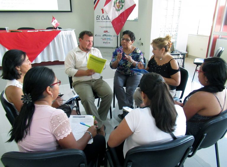CLIA participants discussing ideas in a circle. 