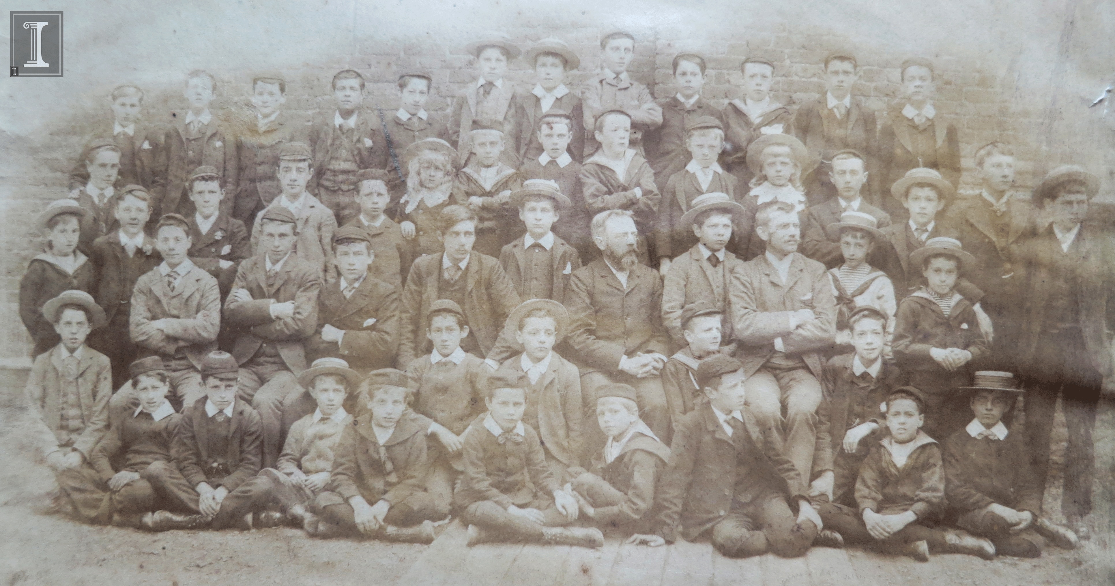 We think Milne and Wells are somewhere in this photo, a group shot of the students and teachers at Henley House School. Can you help us identify them? Milne would have been about eight years old and Wells about twenty-four. Photograph is glued to the front flyleaf of The Henley House School Magazine. London: Ford & Son, 1881-1893. WELLS 828 H389