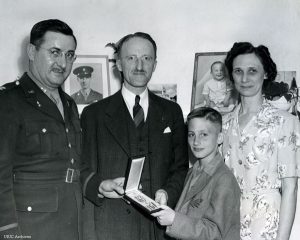 The Snively family receiving James Snively's Silver Star on his behalf.