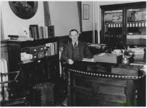 Fred Turner in his office, c. 1930's. Retrieved from R.S. 41/1/20.