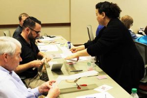 Miriam Centeno, Collections Care Coordinator, leads a hands-on exhibits workshop