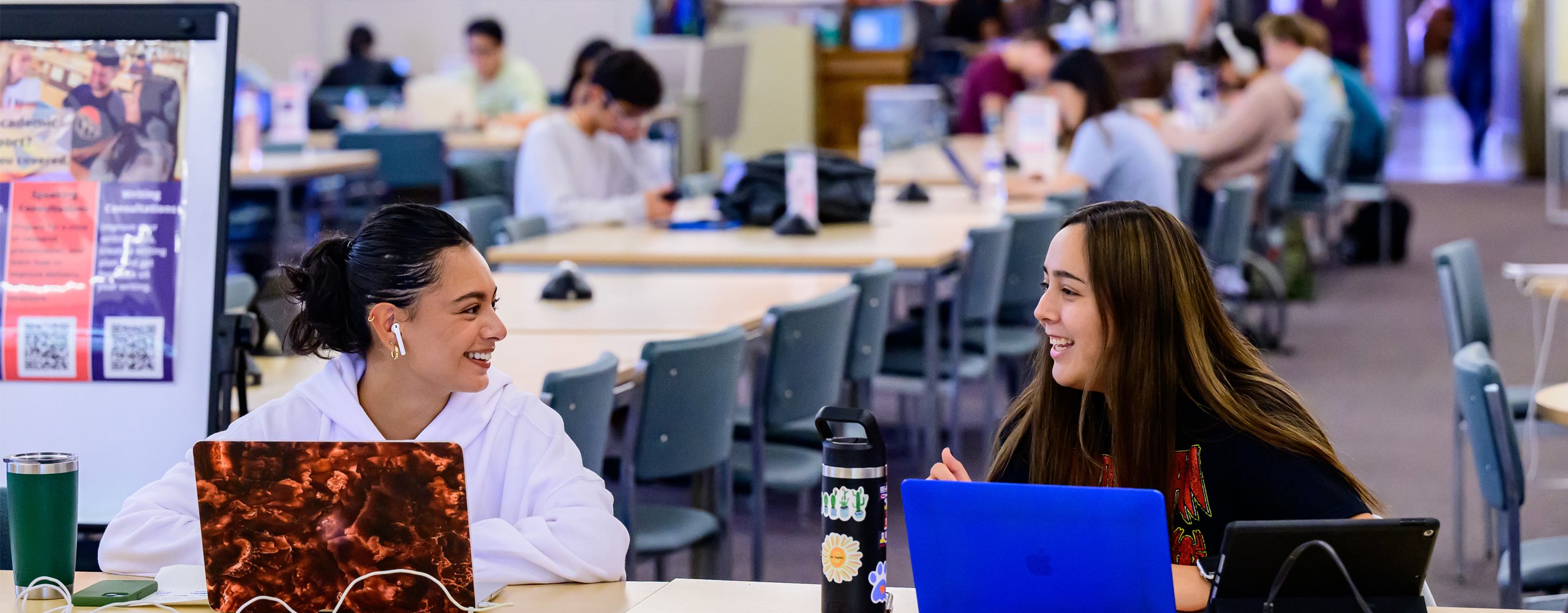 Students chatting in the Main Library Orange Room. (photo by Fred Zwicky)