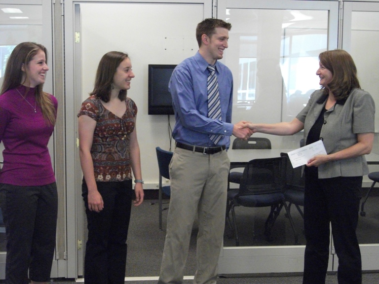1867 Society Executive Coucil members present check to Undergraduate Library.