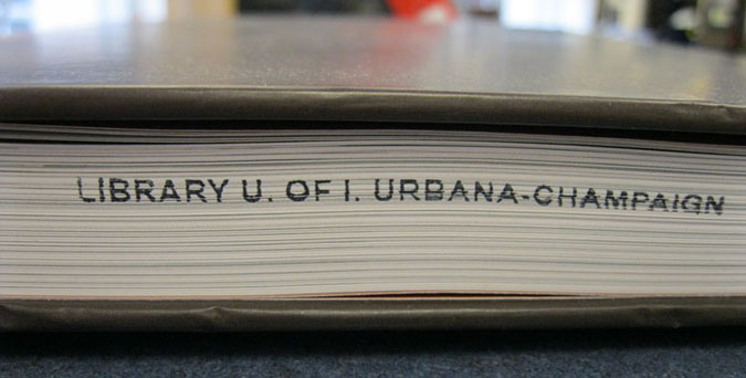 Book with Library U of I Urbana-Champaign on pages