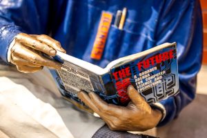 Grainger Bob statue reading book about the future